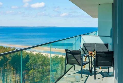 The balcony provides a perfect spot for enjoying the fresh air. 