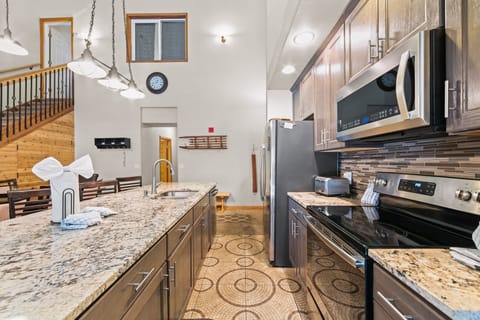 Updated kitchen with granite countertops and stainless steel appliances.