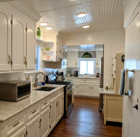 View of kitchen looking the other direction to the coffee bar at the end.