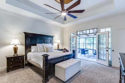 Our first floor master bedroom includes access to a covered patio.