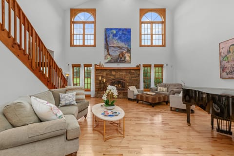 The living room has a gas fireplace (seasonal).  (Piano covered & not available)