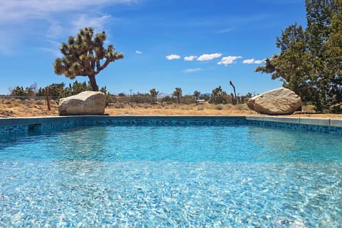 Take a dip in desert paradise. The brand-new in-ground pool at Dez-Art Retreat features a relaxing Baja shelf—perfect for sunbathing or splashing under wide-open skies with views of Joshua Tre