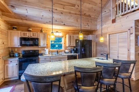 Kitchen - Kitchen with island bar and stools