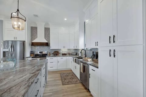 Full kitchen with modern appliances.
