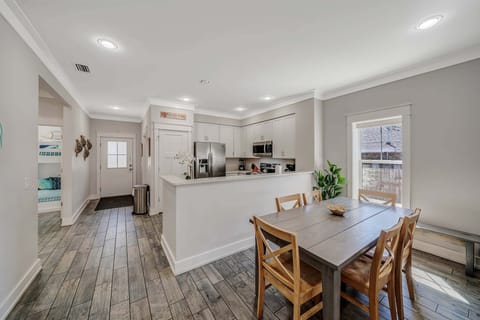 There is a dining table, perfect for enjoying a meal or playing a game.