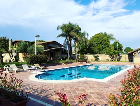Seasonal outdoor pool, open 9:00 AM to 7:30 PM, pool umbrellas