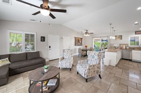 Open living space w/ comfy seating, dining table & kitchen, perfect for easy group hangouts