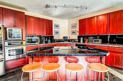 The fully equipped kitchen is a chef`s dream, featuring modern appliances and ample counter space.