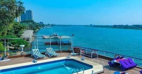 Outdoor pool, open 7:00 AM to 4:00 PM, pool umbrellas, sun loungers