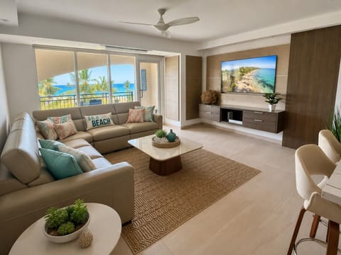 Relax in a spacious, beautifully designed living area surrounded by tropical views.