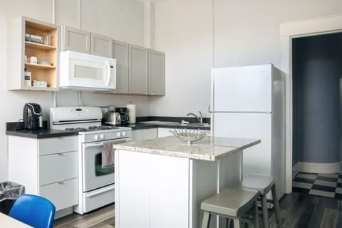 A spacious and modern kitchen with a functional island, perfect for preparing meals and enjoying your stay