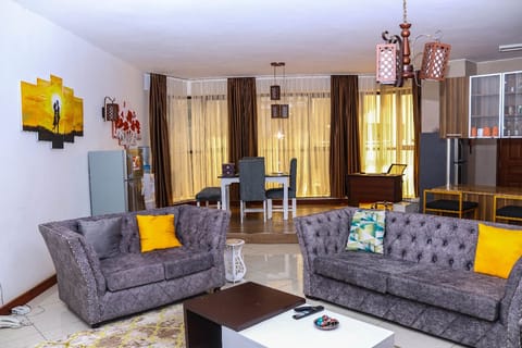 Deluxe Apartment | Living area | 32-inch Smart TV with digital channels