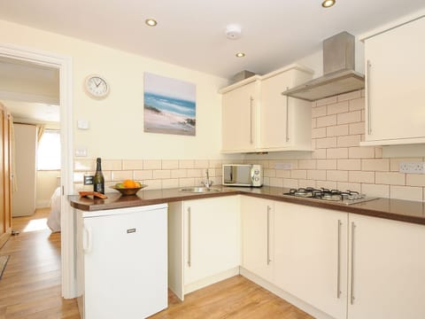 Fridge, electric kettle, cookware/dishes/utensils