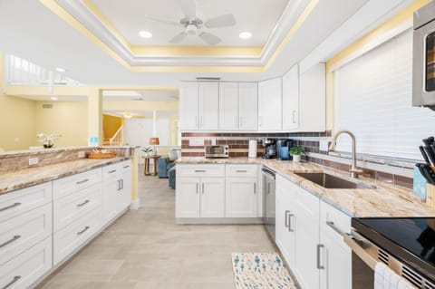 Your gourmet kitchen awaits with granite countertops, premium appliances, and elegant lighting for memorable meal preparation.