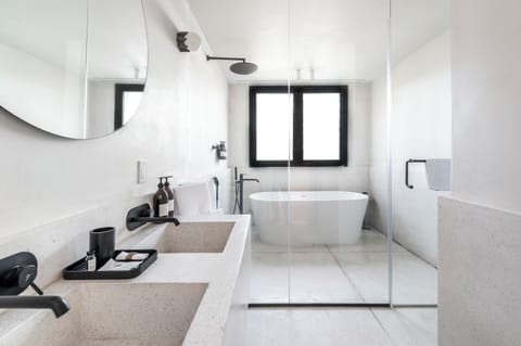 Master Suite | Bathroom | Rainfall showerhead, designer toiletries, hair dryer, towels