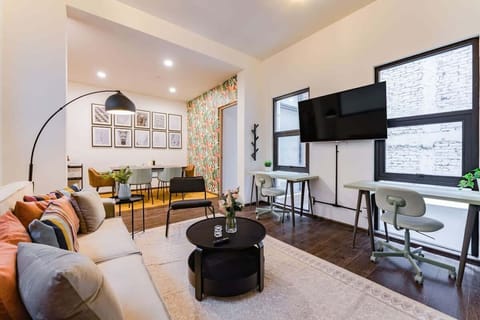 A pair of office desks providing a laptop-friendly workspace