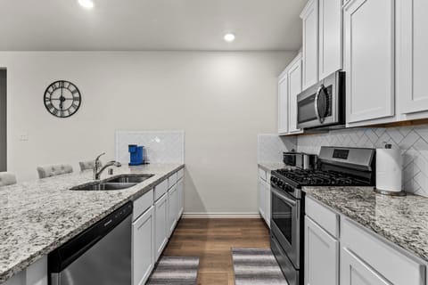 Fully equipped kitchen with modern appliances to support long-term stays and crew meal prep.