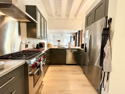 A kitchen with a stove and oven.