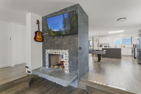 Smart TV by fireplace.