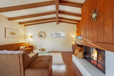 Main living area with smart TV and fireplace