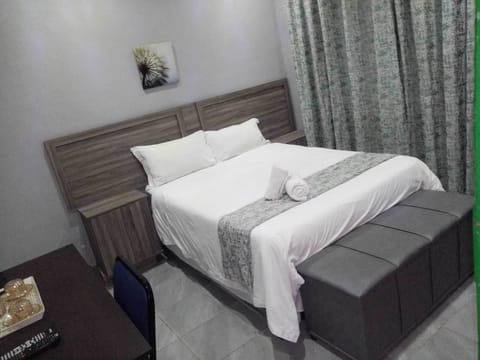 Classic Double Room, 1 Double Bed, Refrigerator, Garden View | Desk, laptop workspace, iron/ironing board (on request), bed sheets