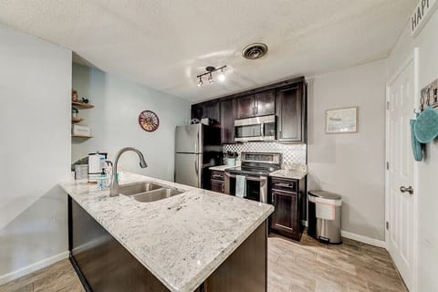 Kitchen with electric range & refrigerator
