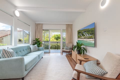 Coastal living with 65-inch Samsung Smart TV, fast Wi-Fi and sofa bed, in Noosa.