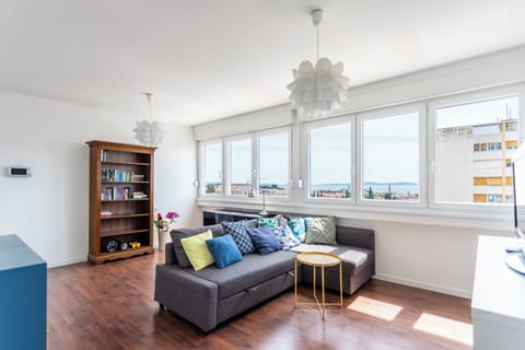 Apartment | Living area | 32-inch flat-screen TV with cable channels