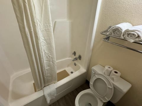 Basic Room, 2 Queen Beds, Non Smoking | Bathroom | Combined shower/tub, rainfall showerhead, towels