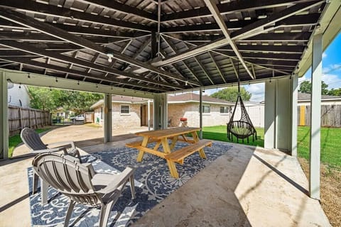 Backyard Oasis: Unwind under the stars in this shaded patio with chic seating and playful vibes.