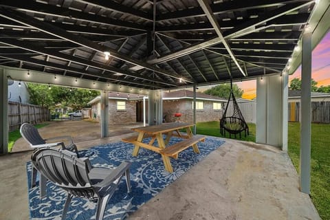 Backyard Oasis: Gather around the picnic table and unwind under twinkling lights,