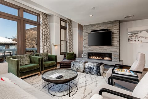 Unit F - Living room with a 55" Smart TV and gas fireplace