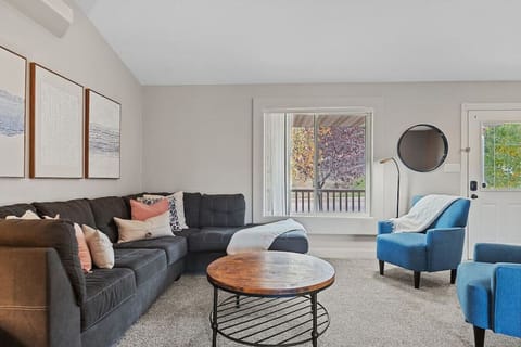 Enjoy your spacious living area with a stylish center table, all bathed in natural light from the huge window.