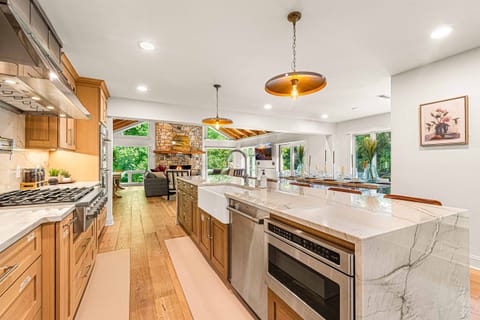 Fully stocked gourmet Kitchen open to two huge great rooms