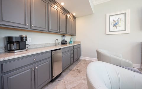 Brew coffee at the Keurig, use the bar sink and blender, or grab a chilled drink from the wet bar