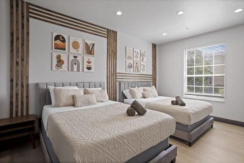 Two queen beds with a private TV and personal nightstands w/  HUGE walk-incloset