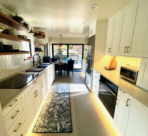 Our kitchen is set up for cooking! There are plenty of pots, pans and dishes to cook a great meal.
