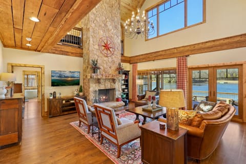 Main living area with two story fireplace and views of Grandfather Mountain. 