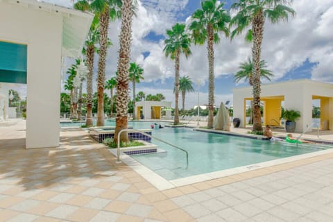 Your tropical oasis awaits with sparkling pools surrounded by swaying palms and modern poolside pavilions.