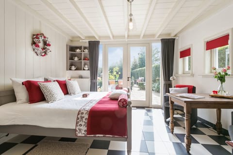 Deluxe Double Room, Garden View, Ground Floor | In-room safe, blackout drapes, soundproofing, iron/ironing board