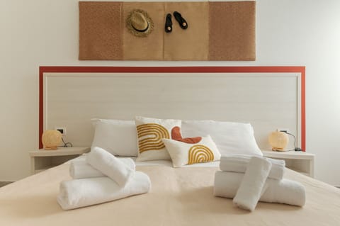 Standard Triple Room | Minibar, in-room safe, desk, blackout drapes