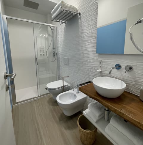 Comfort Room, 1 Queen Bed | Bathroom | Shower, rainfall showerhead, hair dryer, bidet