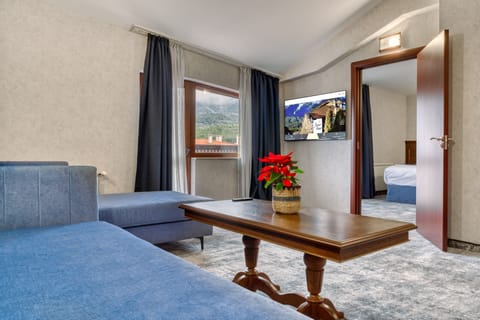 Apartment | Living area | 50-inch flat-screen TV with cable channels