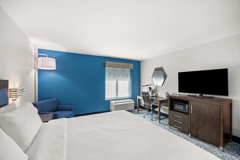 Desk, laptop workspace, blackout drapes, iron/ironing board