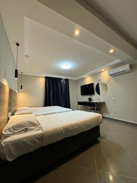 Premium bedding, desk, laptop workspace, soundproofing