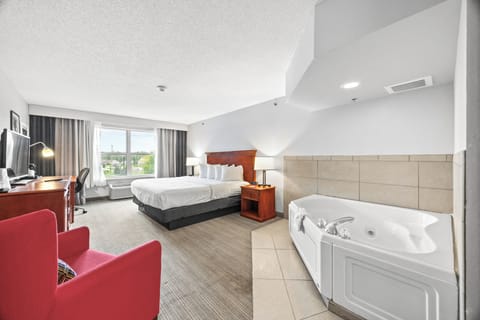 King Jacuzzi | Frette Italian sheets, premium bedding, pillowtop beds, desk