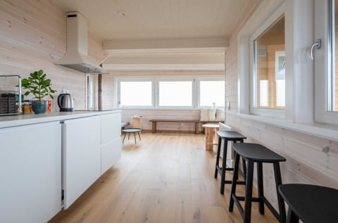 Mini-fridge, stovetop, cookware/dishes/utensils