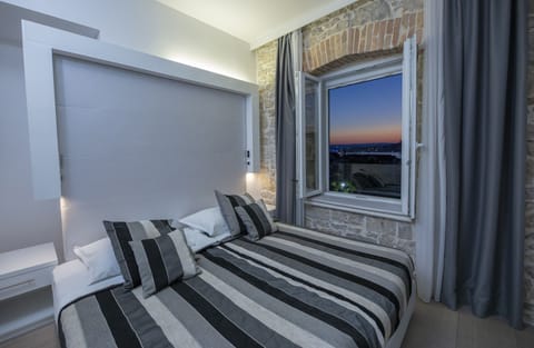Deluxe Double or Twin Room, Partial Sea View | Premium bedding, memory foam beds, minibar, in-room safe