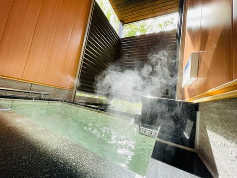 Comfort Villa | Bathroom | Deep soaking tub, rainfall showerhead, hair dryer, slippers