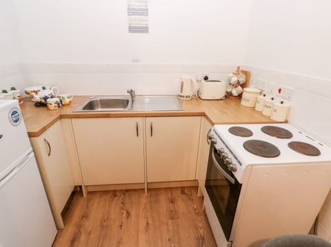 Fridge, electric kettle, toaster, cookware/dishes/utensils